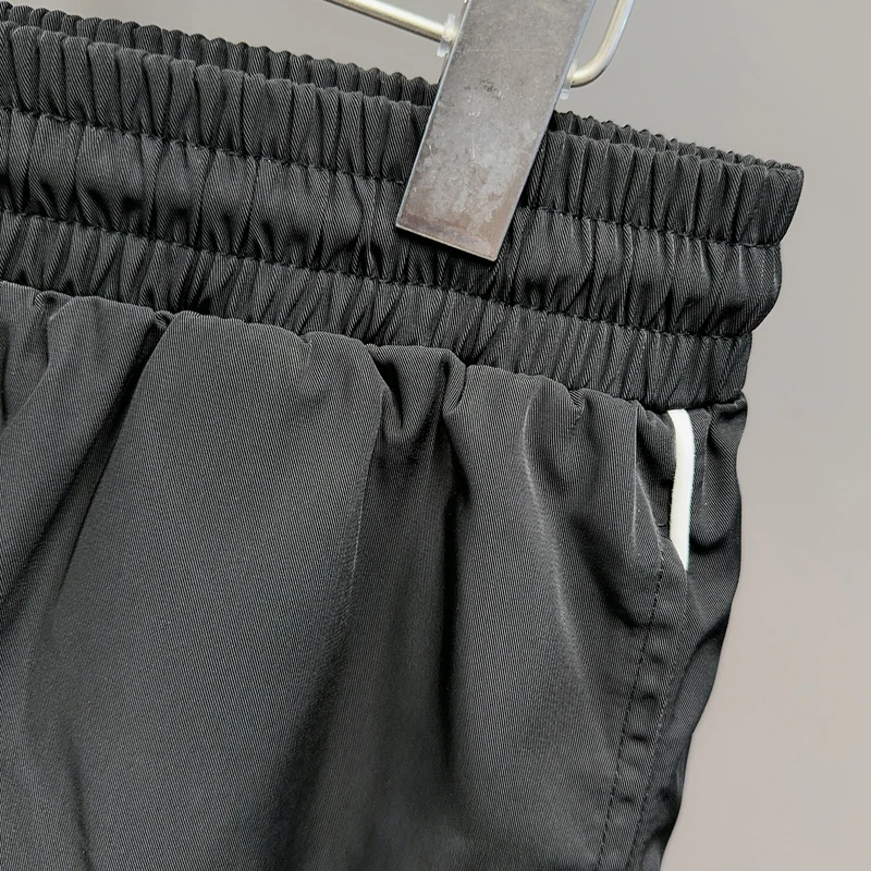 黒刺繍コスモススターリングバスケットボールショーツメッシュ速乾性 Jorts 男性女性ルーズ巾着ウインドブレーカースポーツショートパンツ