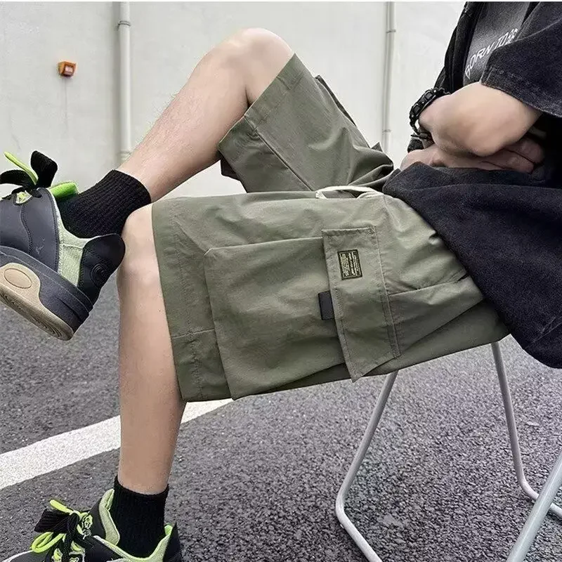 ยาว Baggy พร้อมกระเป๋าเอวยางยืดหลวม Draw String กางเกงขาสั้นสําหรับชายเบอร์มิวดา Half Oversize Mens Cargo กางเกงขาสั้นกว้าง