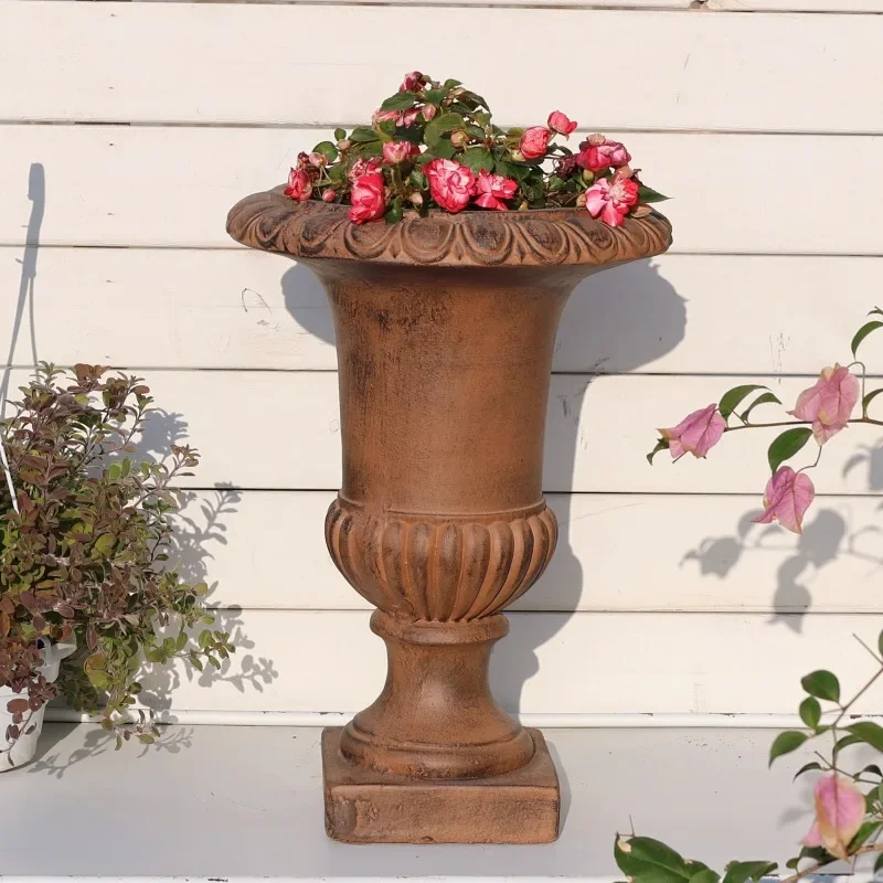 Distressed vintage brown high-stemmed Roman flowerpot, simple indoor balcony, outdoor garden, courtyard decorative ornament