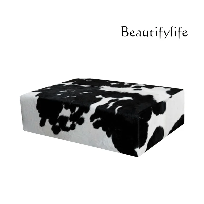 

Nordic high-end living room home light luxury simple designer creative milk cowhide ottoman