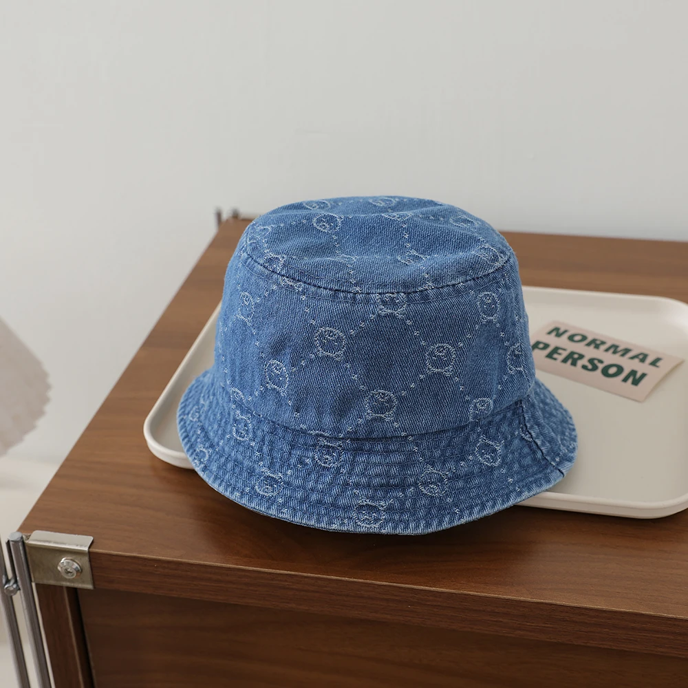 Retro washed baby denim fisherman hat with full pattern of diamond-shaped jacquard and a small bear on the brim