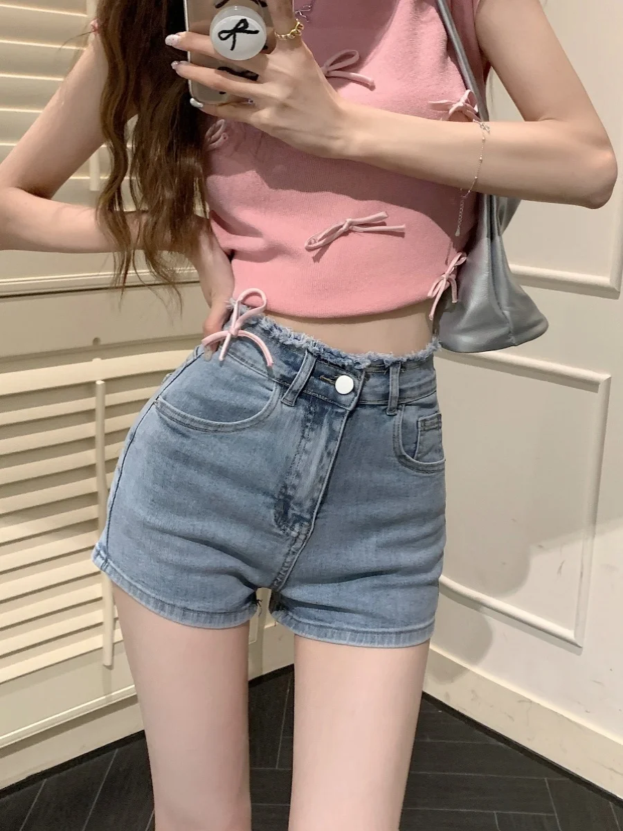 جينز نسائي أمريكي بنمط سكايبي، مطرز بعقدة وشراشيب، بخصر عالٍ وساق مستقيمة ضيقة، مناسب للصيف