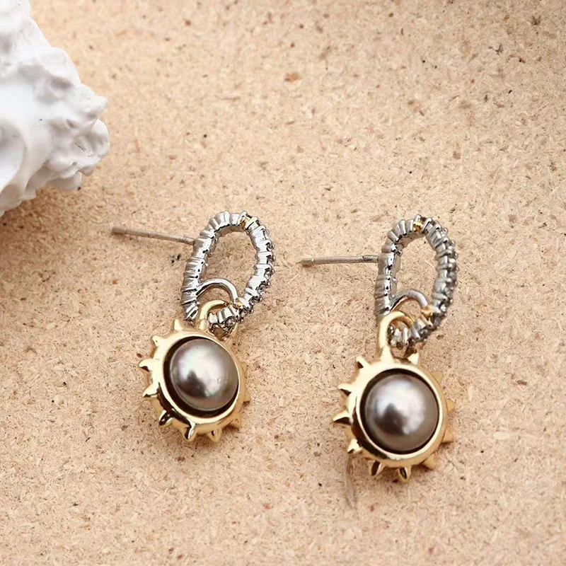 

Simple temperament retro sunflower inlaid with pearl zircon earrings for women