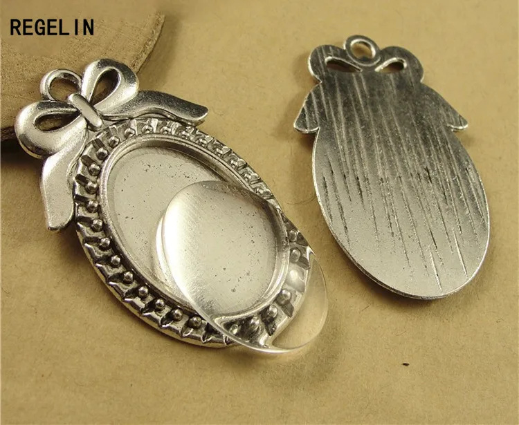 REGELIN 10pcs/lot Two color filigree bowknot cameo cabochon base setting pendant tray 18*25mm Blanks For DIY Jewelry Making