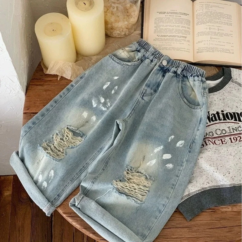 

Cool Boys Street Style Ripped Baggy Jeans With Holes on the Knees Kids Child Fashion Broken Denim Pants with Drawings Print