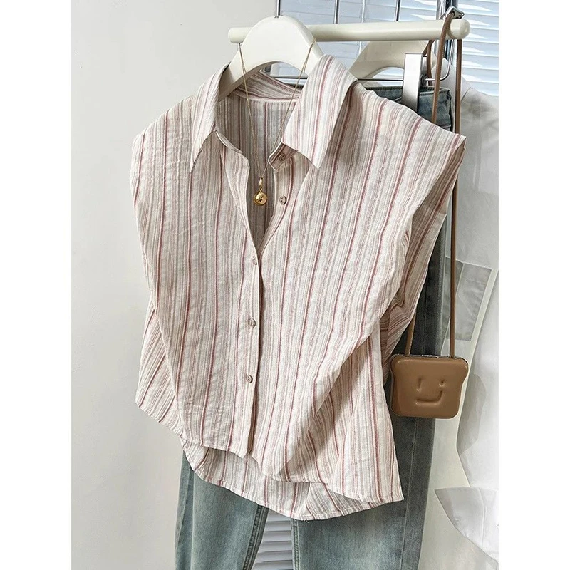 Camicia a righe asimmetrica allentata con bottoni alla moda Abbigliamento femminile 2025 Estate Nuove magliette casual Camicetta da donna senza maniche da ufficio