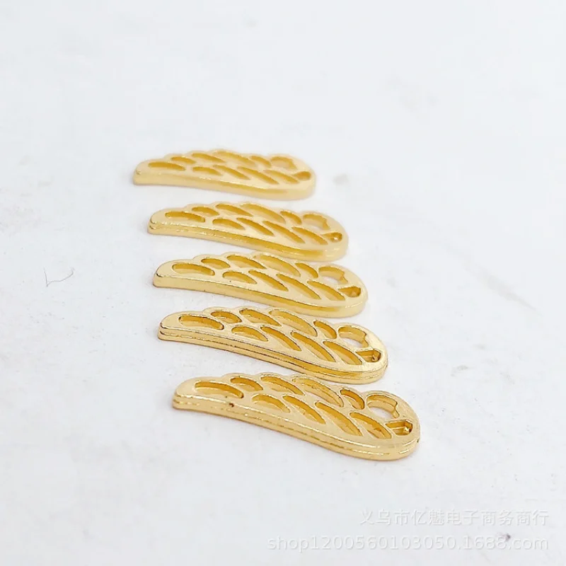 Factory Direct Sales 100Pieces diy Ornament 24x9mm Fitted Wings Hollow Wing Pendant Clothing Bags Zipper Head Materials