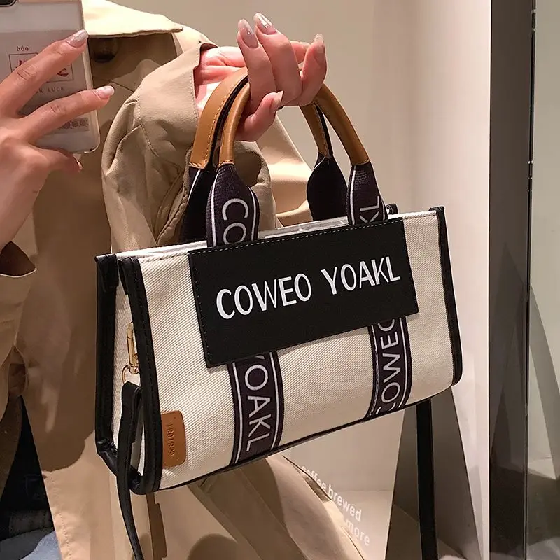 

Large Capacity Canvas Bag Women's 2026 New Cloth Bag Niche Portable Class Commuter Tote Handbags Cloth Bag Messenger Handbags