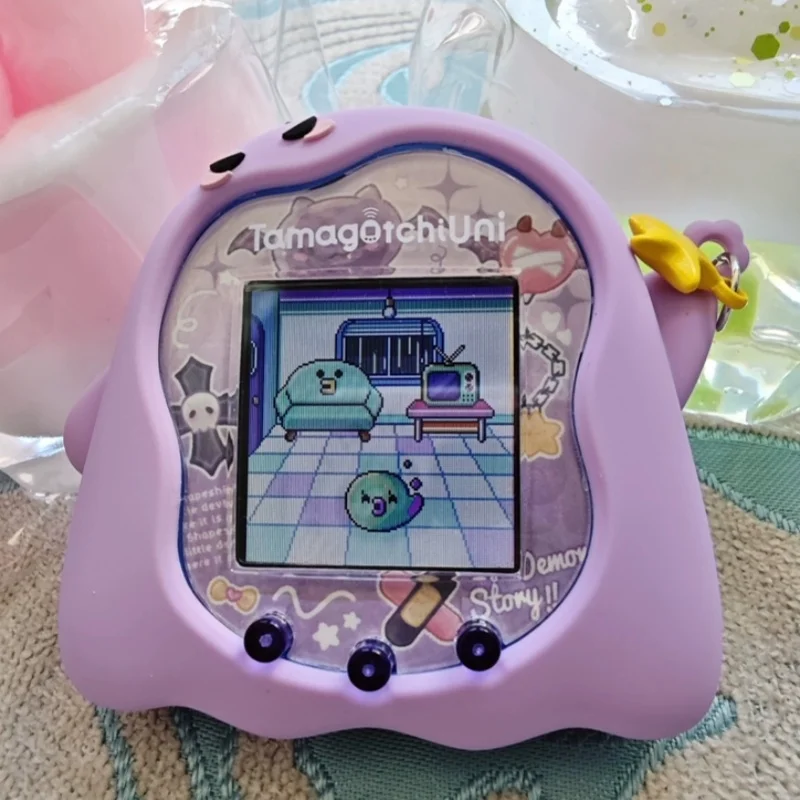 Etui na cyfrowego zwierzaka Tamagotchi Uni - świecące w ciemności diabełkowe fioletowo-różowe silikonowe etui ochronne na zabawkę