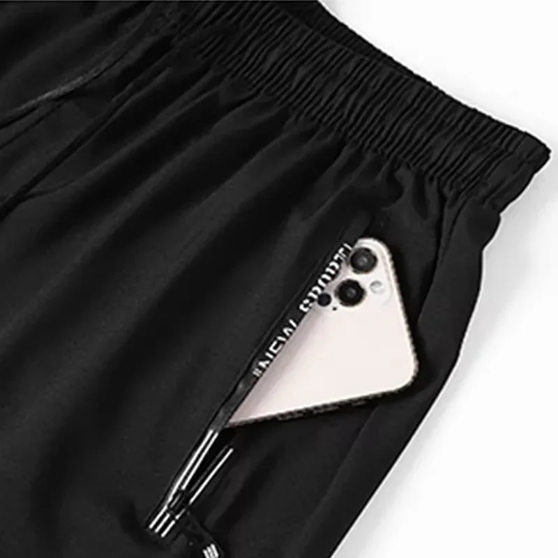 الرجال حجم كبير السراويل غير رسمية 6XL 7XL حجم كبير رياضة السراويل الرجال بسط الصيف الشاطئ سراويل قصيرة سريعة الجافة تنفس الذكور الملابس