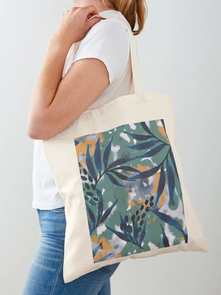 

Indigo leaf pattern on green and orange background with blue flowers Tote Bag hand bags reusable shopping bags