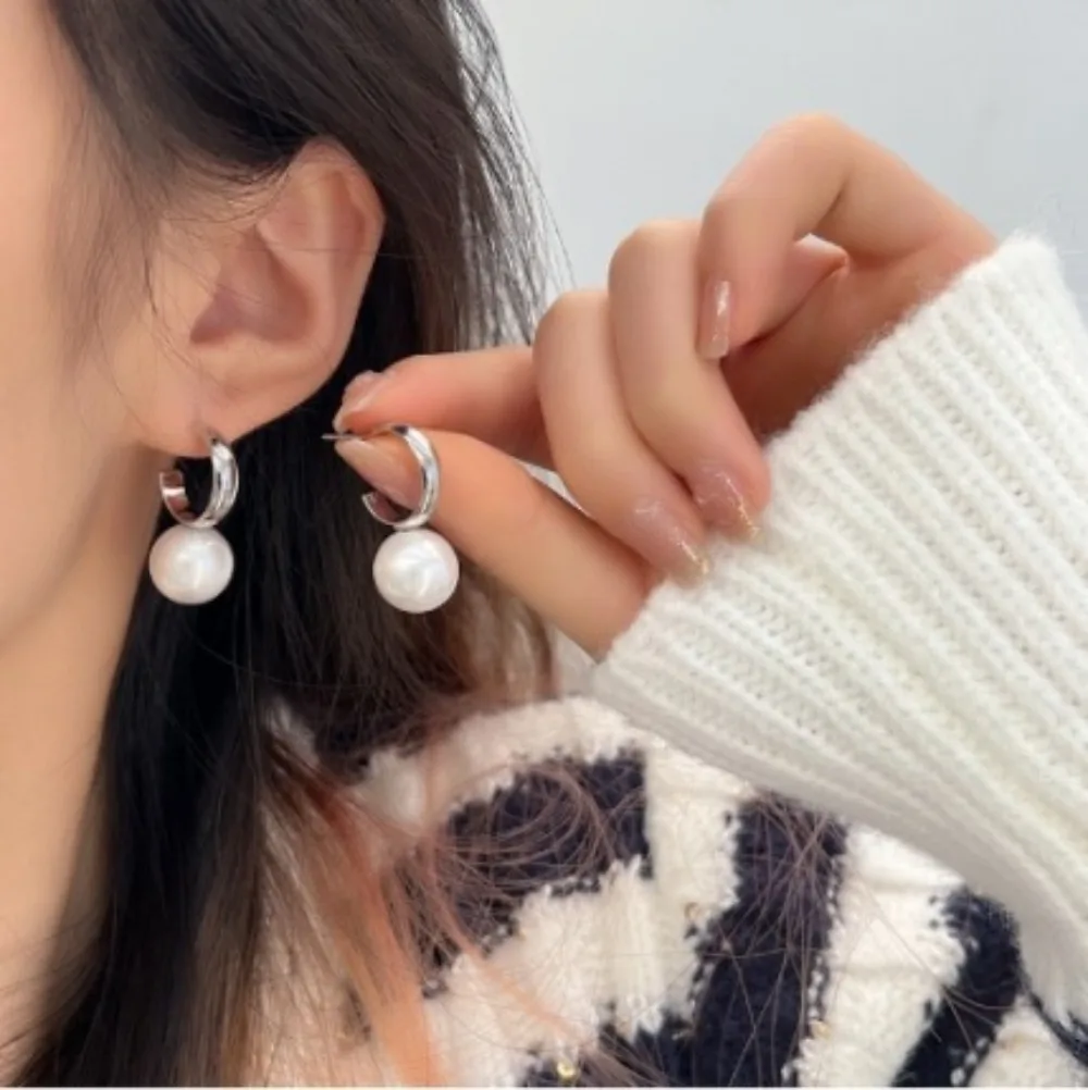 Two pairs of fashionable, light luxury, elegant and grand women's pearl earrings set with zircon