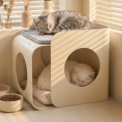 Casa nido escondida de lujo para gatos con mesa de centro