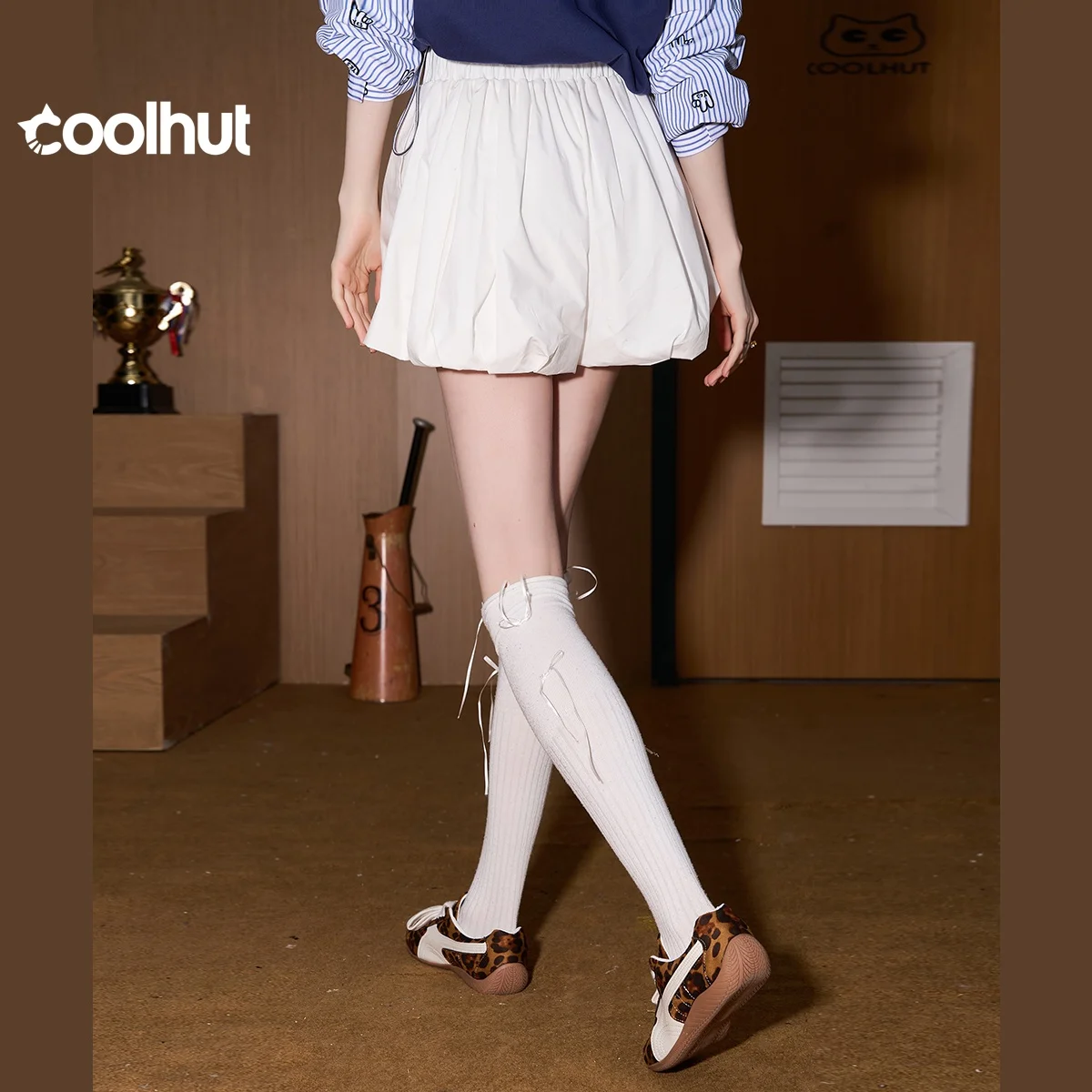 COOLHUT 2025 femmes taille haute ample gonflé Anti-flash décontracté ajustement élastique couleur unie courte jupe bouffante Style doux