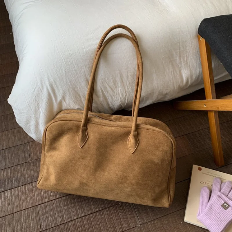 

Elegant Pom Pom Accent Bag For Ladies With Playful Decorations And Buttery Soft Leather