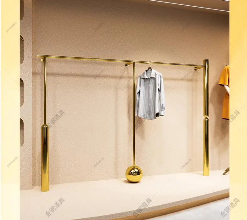 

Clothing store display shelf wall hanging floor stainless steel titanium gold hanging clothes shelf women's store display shelve