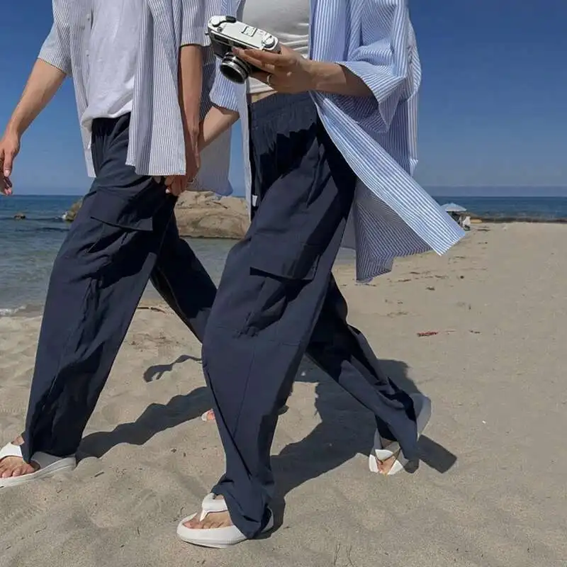 Pantaloni cargo da uomo in vita elastica tinta unita tasca grande laterale abbigliamento da uomo casual pantaloni larghi da uomo a gamba larga Cleanfit P020