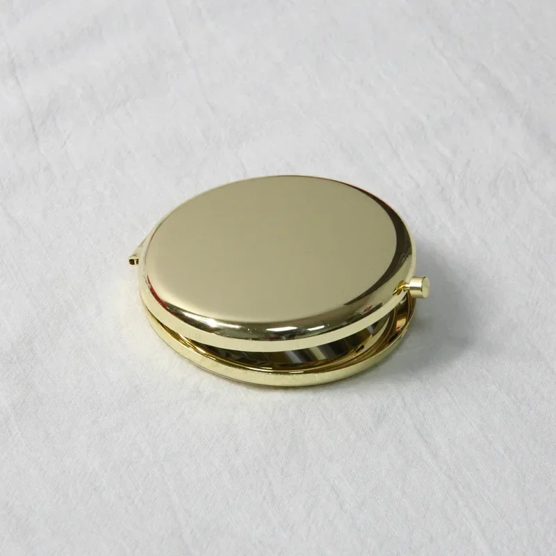 Miroir de poche rond double face en métal, mini miroir de maquillage pliant, tenu dans la main, cadeaux cosmétiques, sac à main de voyage