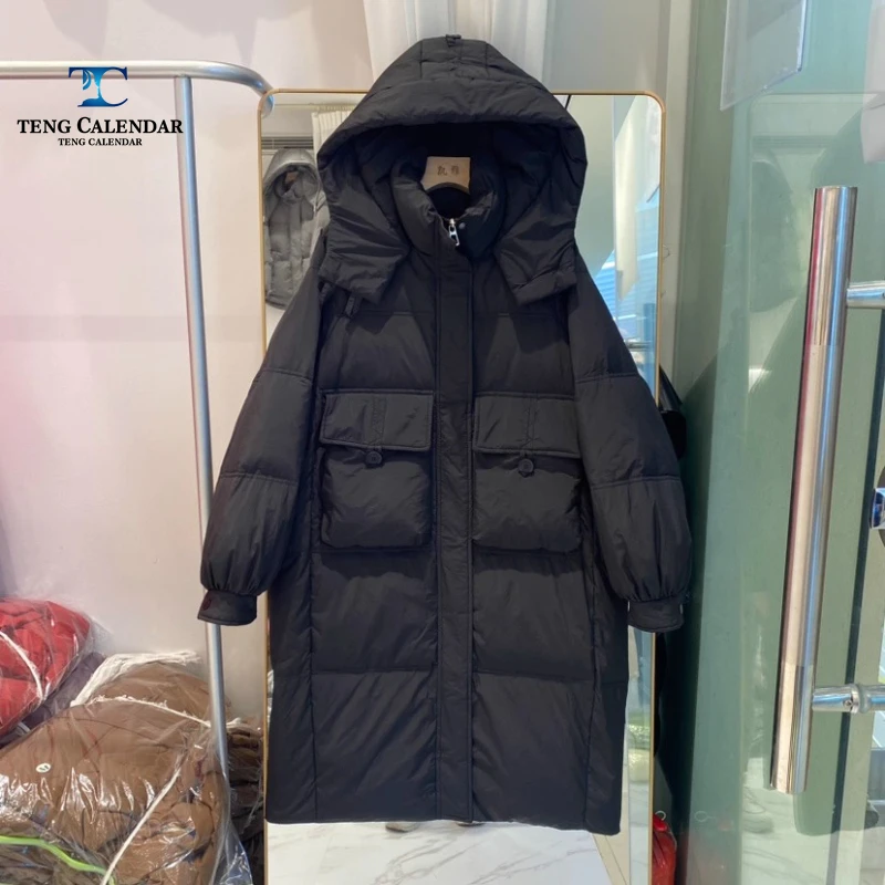 Korean style waist cinched hooded down jacket, medium to long thick and warm over the knee jacket, women 2025 winter new style