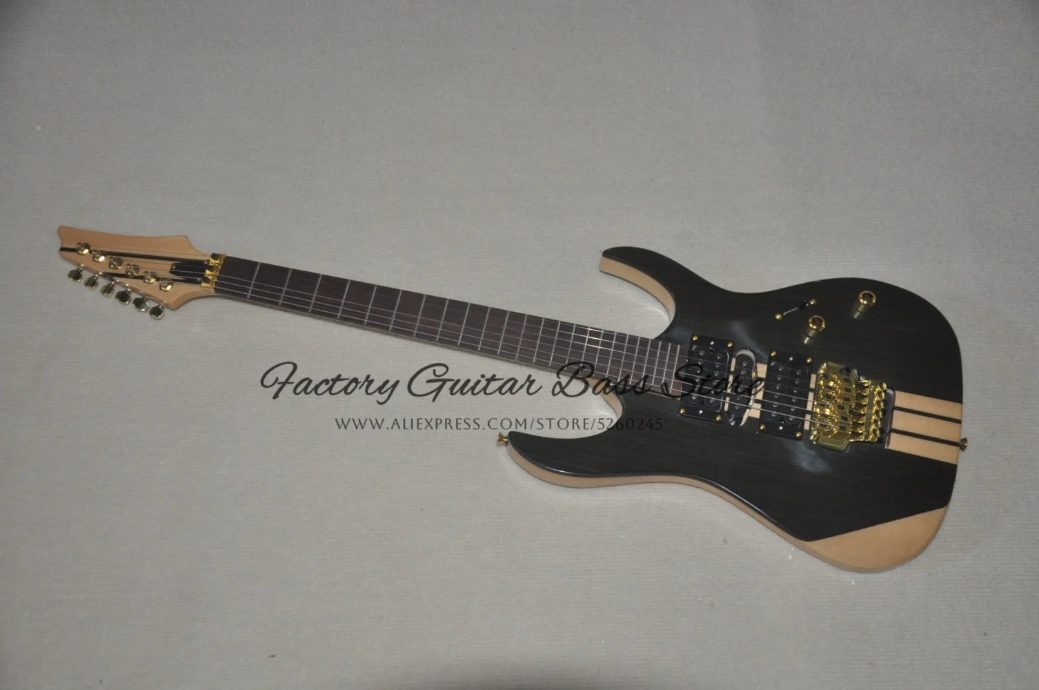 Natural guitar, tremolo bridge, maple neck through technical solid wood body， HSH pickups, golden tuner