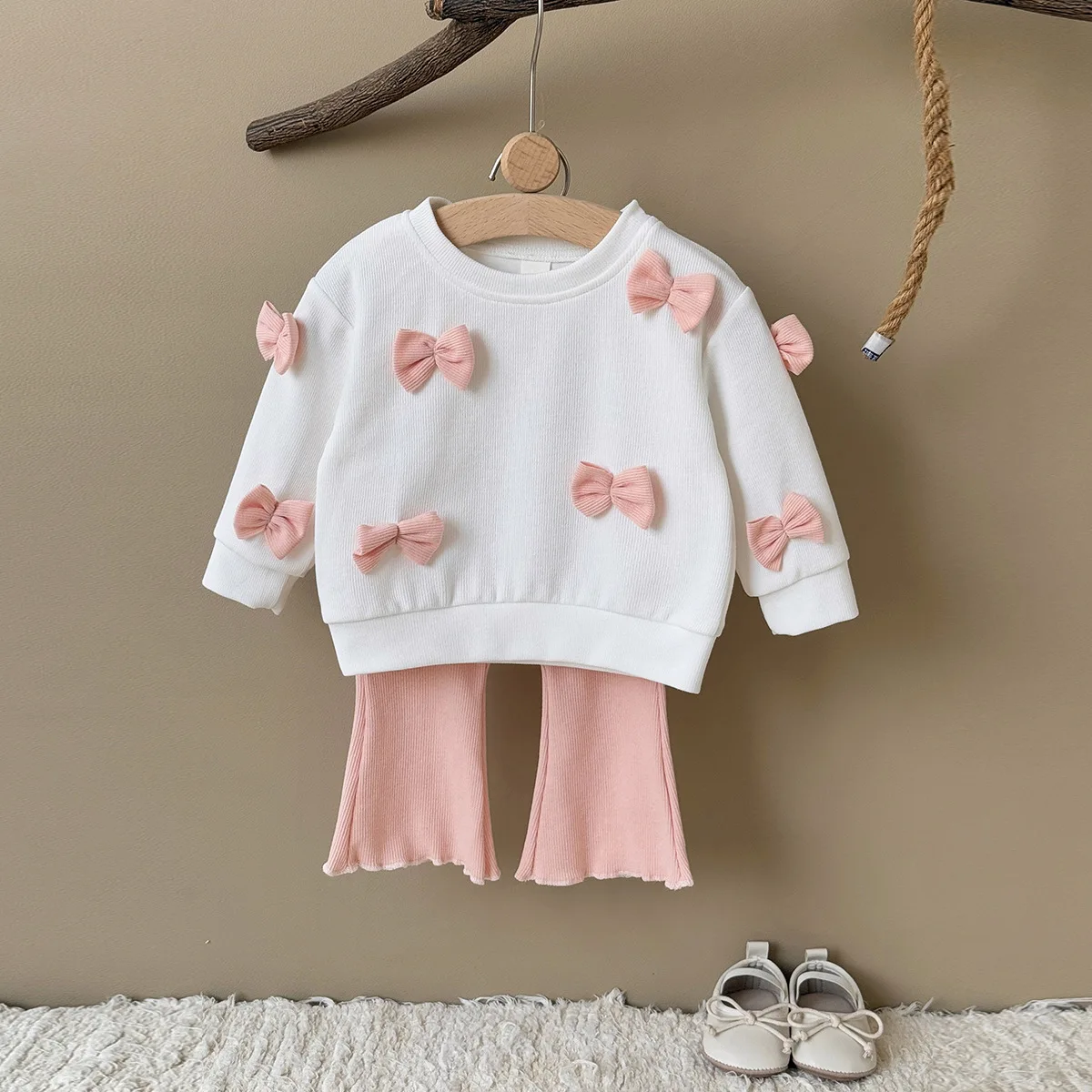Two-piece set with a bow top and flared pants casual comfortable versatile stylish outing outfit for baby girls
