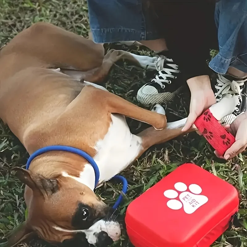 A comprehensive pet first aid kit with scissors, tweezers, tourniquets, sterile gauze and other medical and first aid supplies