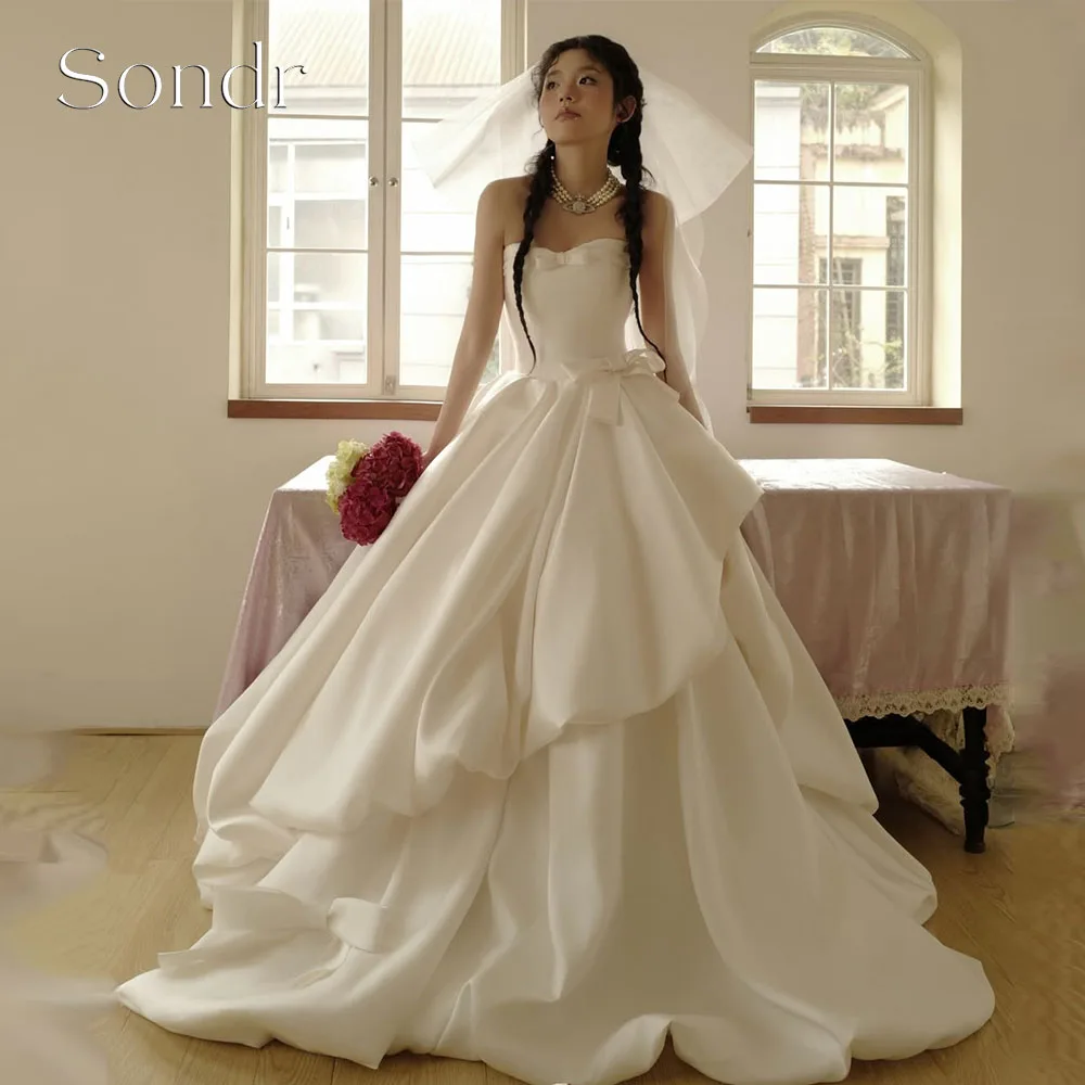 

Sondr Customized Princess A Line Korean Wedding Dresses Strapless Fluffy Satin Bridal Gown with Bow Corset Wedding Party Dr