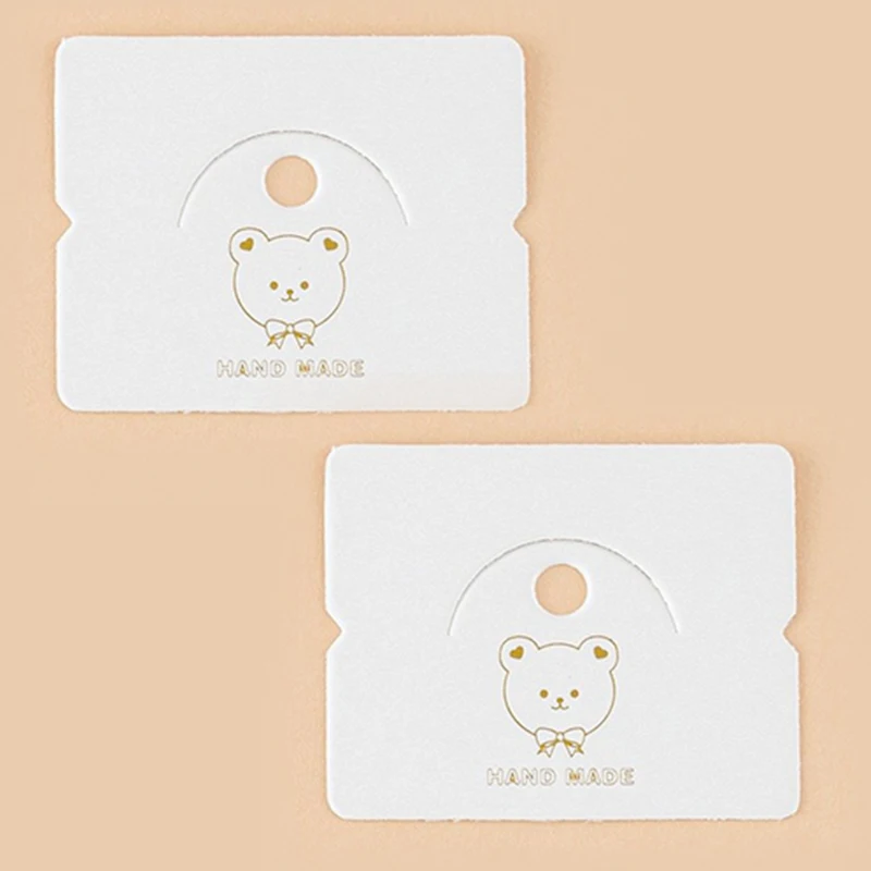 Tarjetas de exhibición de joyería para el cabello, tarjetas de embalaje con patrón de oso, estampado dorado, cuerda para el cabello, pulsera, collar, etiqueta de precio al por menor, 50 piezas