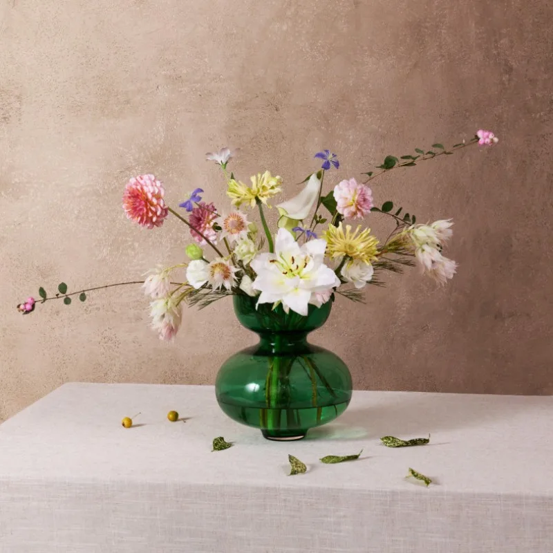 Green vase living room dining table flower arrangement