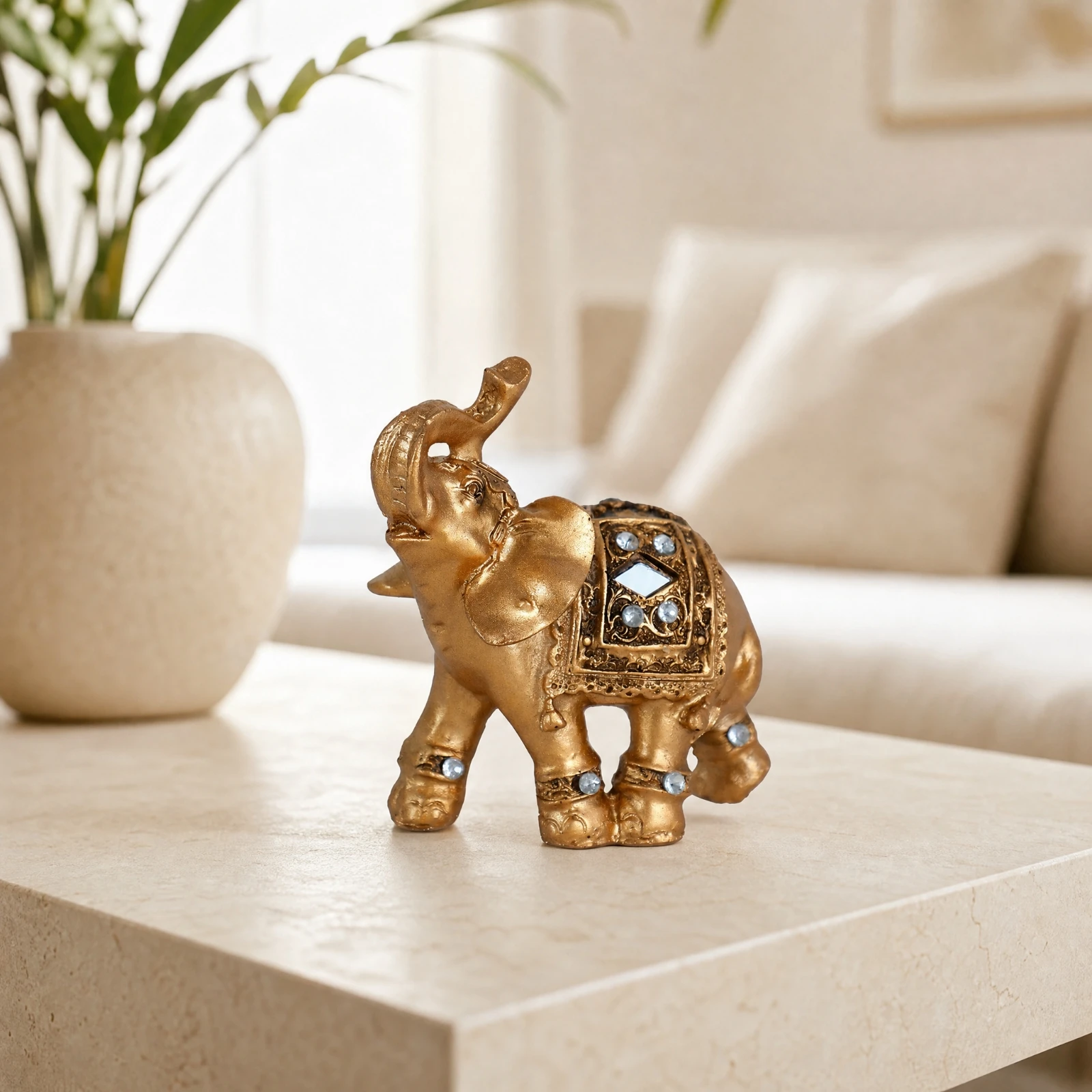 Ornate Elephant Figurine with Decorative Saddle Auspicious Gold-Toned Elephant Decor with Raised Trunk Compact Modern