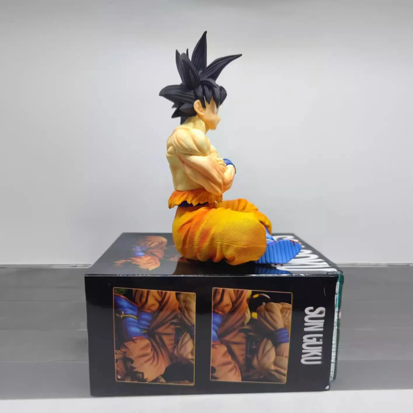 Figurines Dragon Ball Son Goku, 15cm, Figurine d'action assise, modèle en Pvc, Collection de statues, jouets de décoration, poupée d'ornements cadeaux