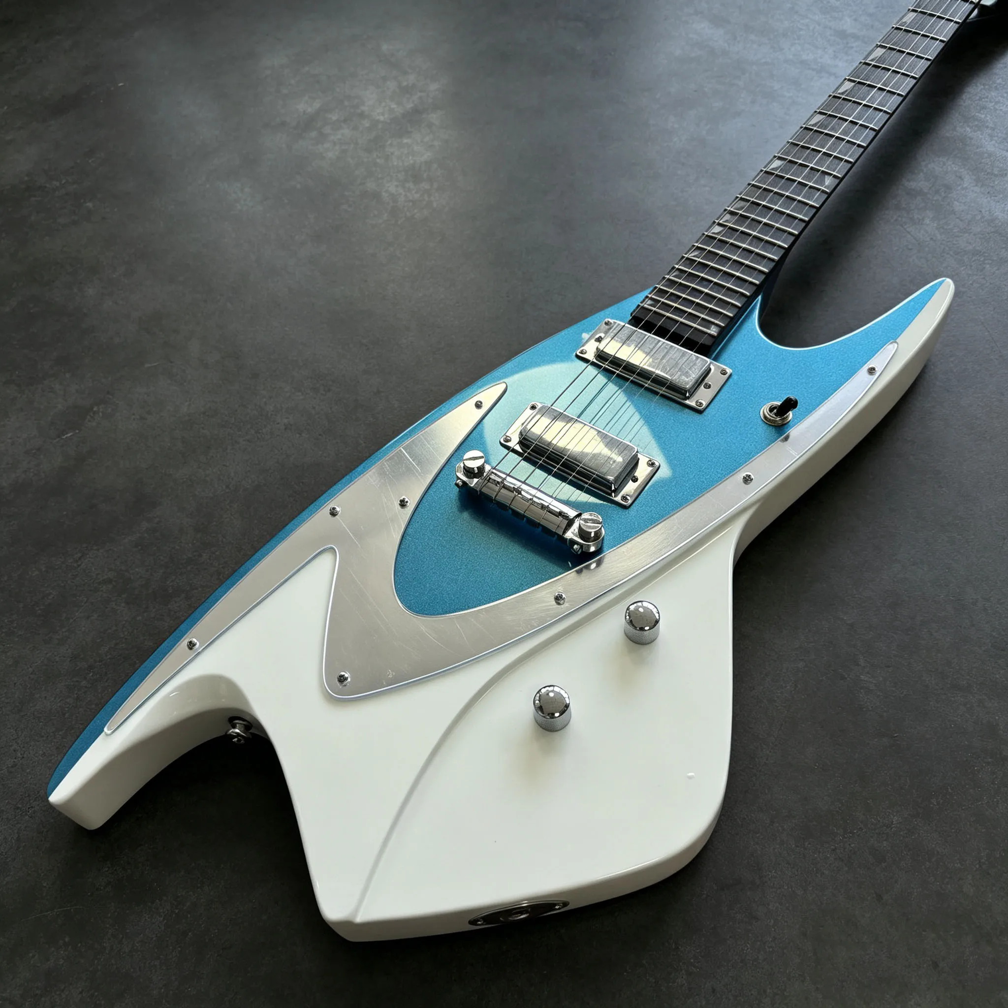 Electric Guitar Sharp Shark-Fin Body Contour Blue White Contrast Finish Highly Recognizable Space-Age Aesthetics Future Retro.