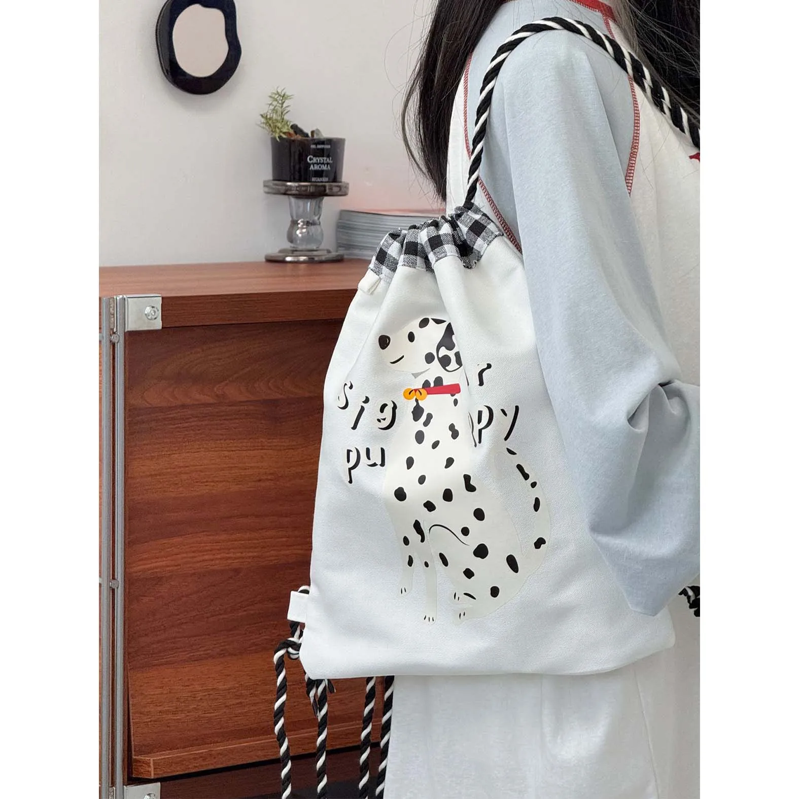 

Cute spotted dog print drawstring drawstring backpack with high appearance, 2025 summer new casual versatile student backpack