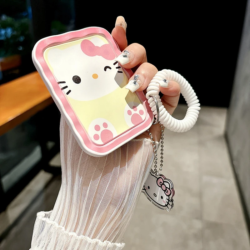 Santio Hello Kitty กระจกแต่งหน้าพับได้ขนาดเล็กพร้อมน่ารักพกพาได้ COM สำหรับผู้หญิงหญิงสาวกระจกแต่งหน้าแบบมือถือขนาดเล็กจี้