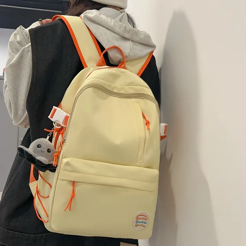 

Minimalist Cream Yellow Backpack For Women Durable Casual Rucksack With Cat Ear & Dog Charm Detail