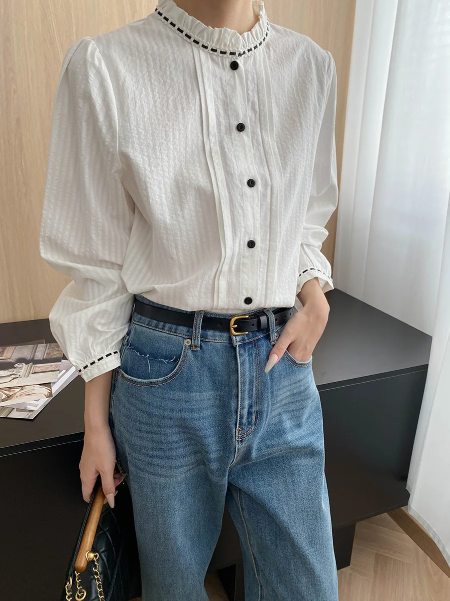 

Commuting design with a blend of natural silk and cotton, French lace, stand up collar, textured pleated shirt