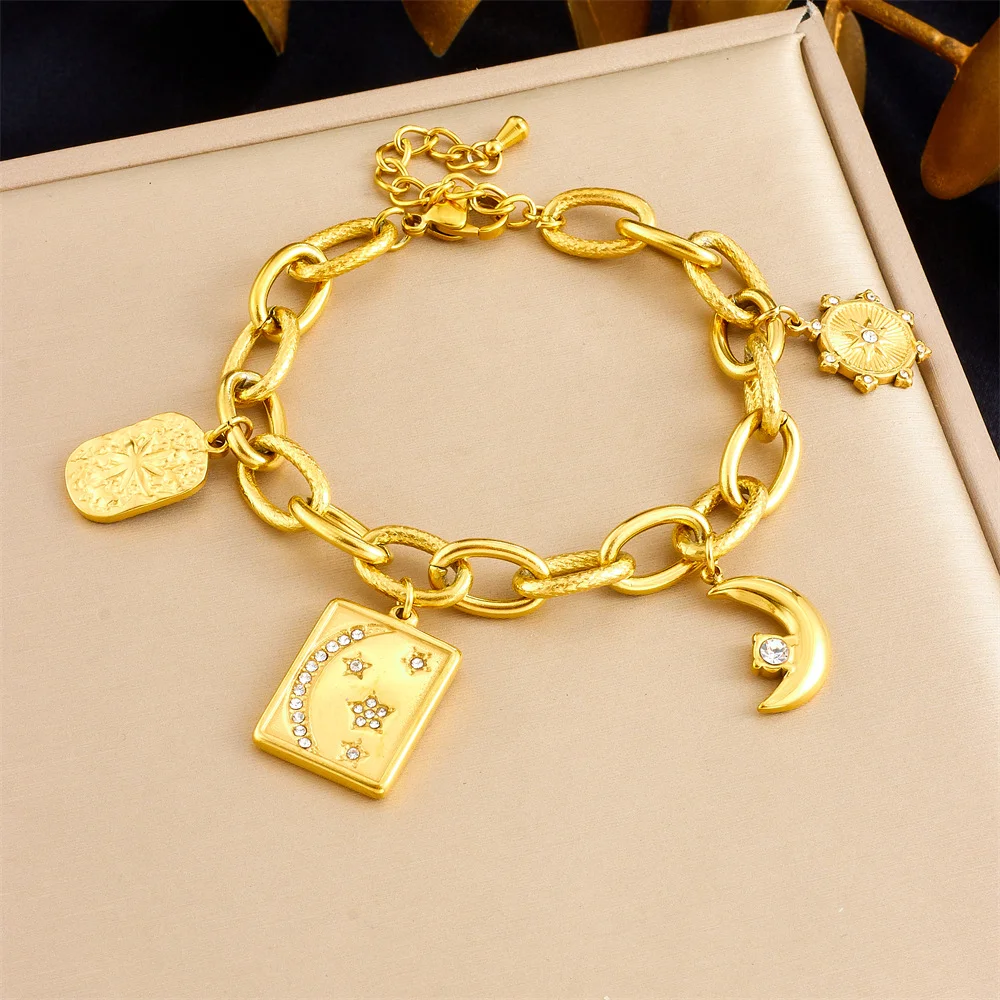 

Gold Tone 316L Stainless Steel Celestial Charm Bracelet with Moon, Star & Sun Pendants for Women