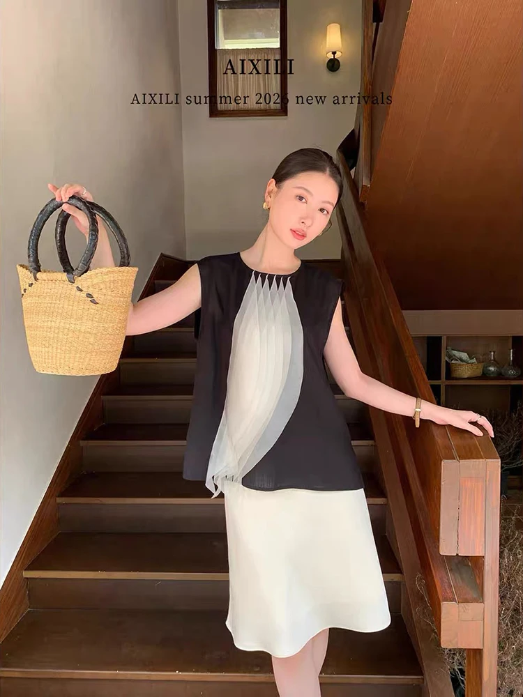 Design-inspired black and white contrast patchless sleeveless vest - a stylish workwear top for 2026 summer season