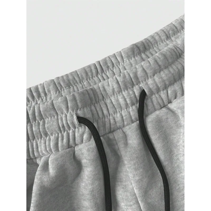 As calças esportivas de perna reta de cor sólida são adequadas para todas as estações outono e inverno, ajuste solto, unissex e casual de rua