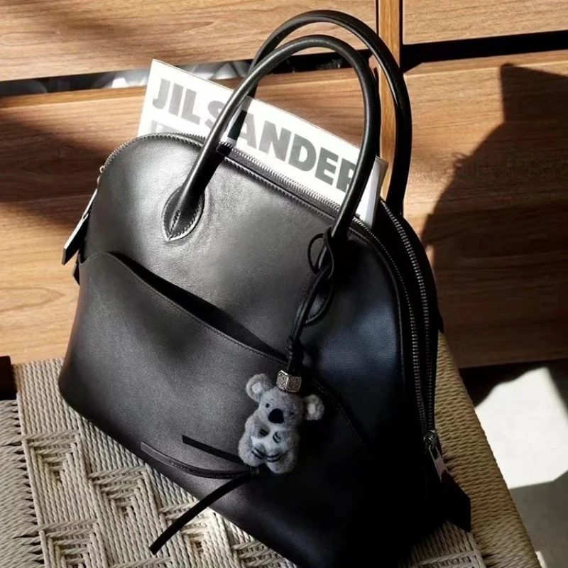 

High Quality Light Luxury First Layer Swift Cowhide Shell Bag Portable Bowling Bag Business Commuter Temperament Versatile