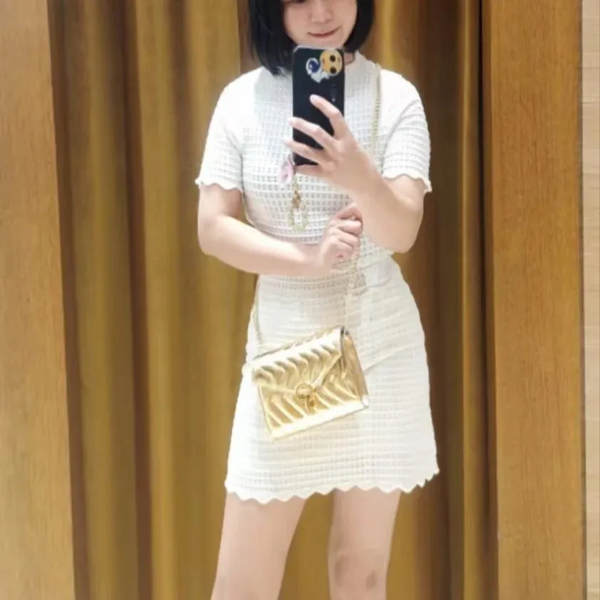 

Women's white hollow two-piece suit short-sleeved round neck cardigan or slim short skirt