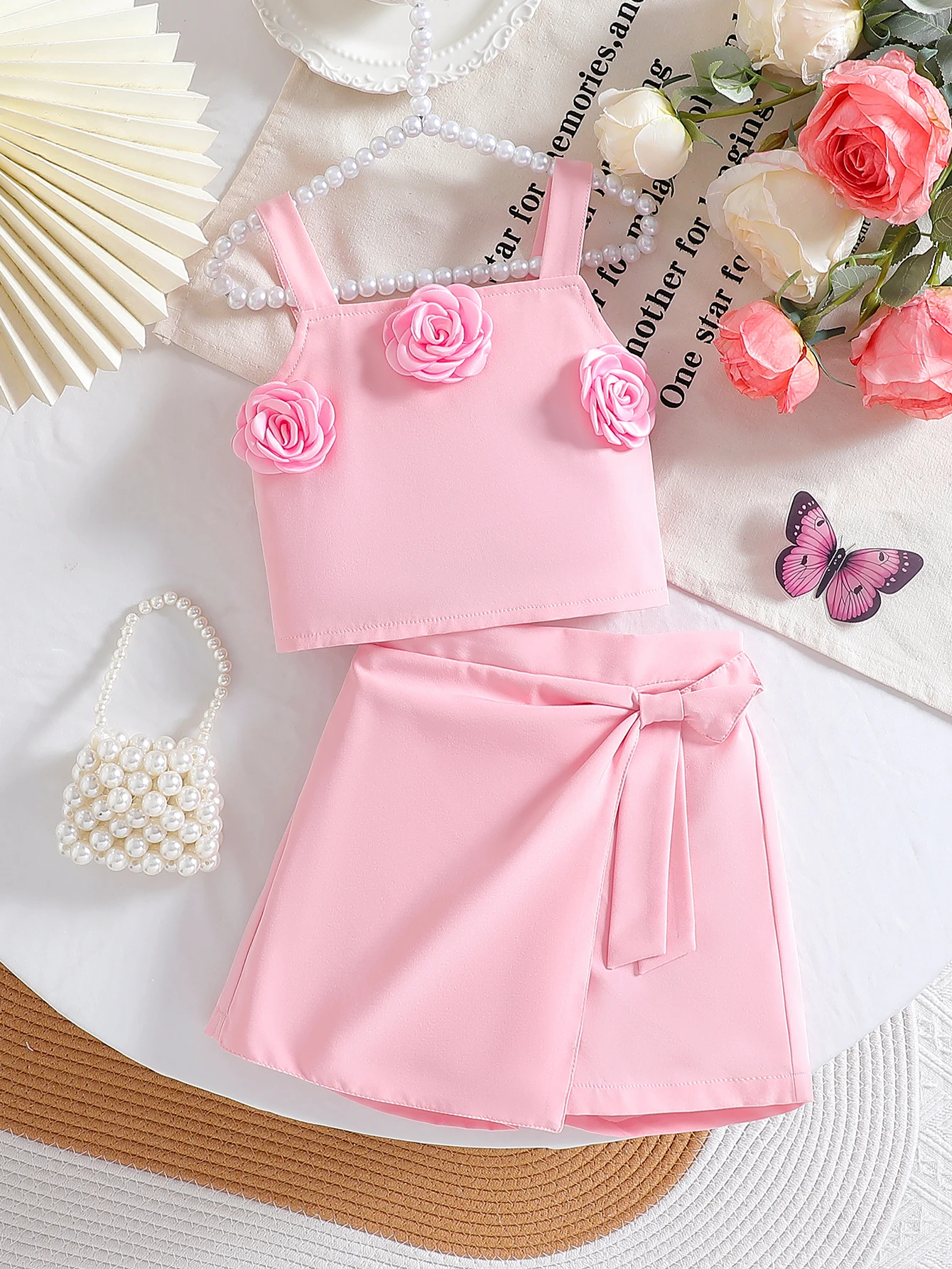

2025 Summer New Arrival Solid Color 3D Flower Strap Top and Solid Color Romper Skirt Two-Piece Casual Set