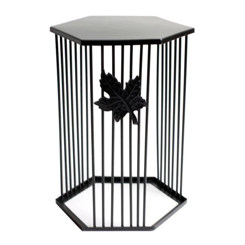 The iron table set up a table, snacks, fruits, dessert plates, and displayed iron frame flower stands