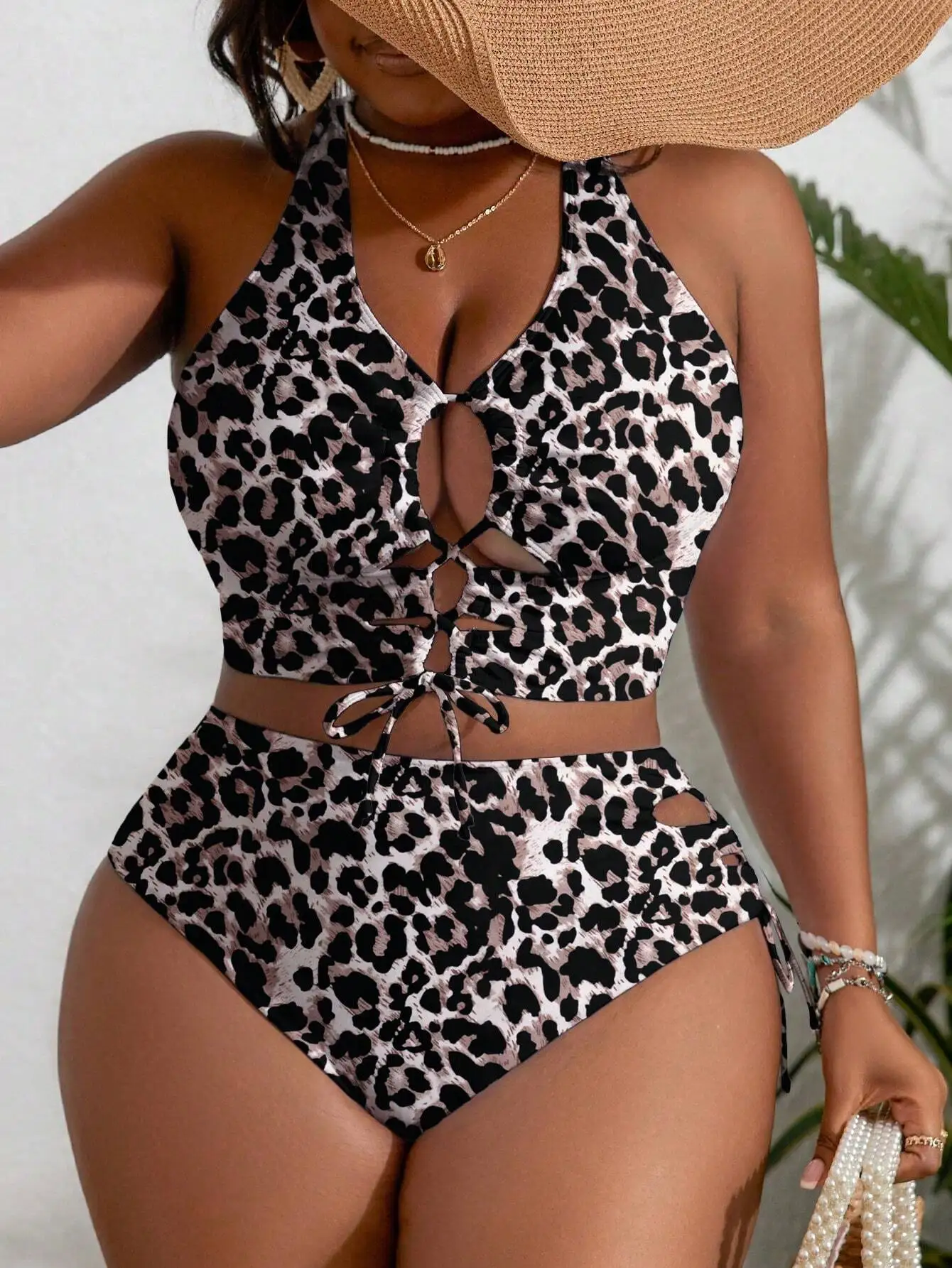 

Curvy Women's Leopard Print High-Waisted Halter Bikini With Front Cutouts And Adjustable Tie Details