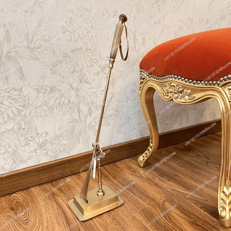 

Brass beef bone long handle household creative shoehorn imported from India light luxury shoe carrying device retro entrance