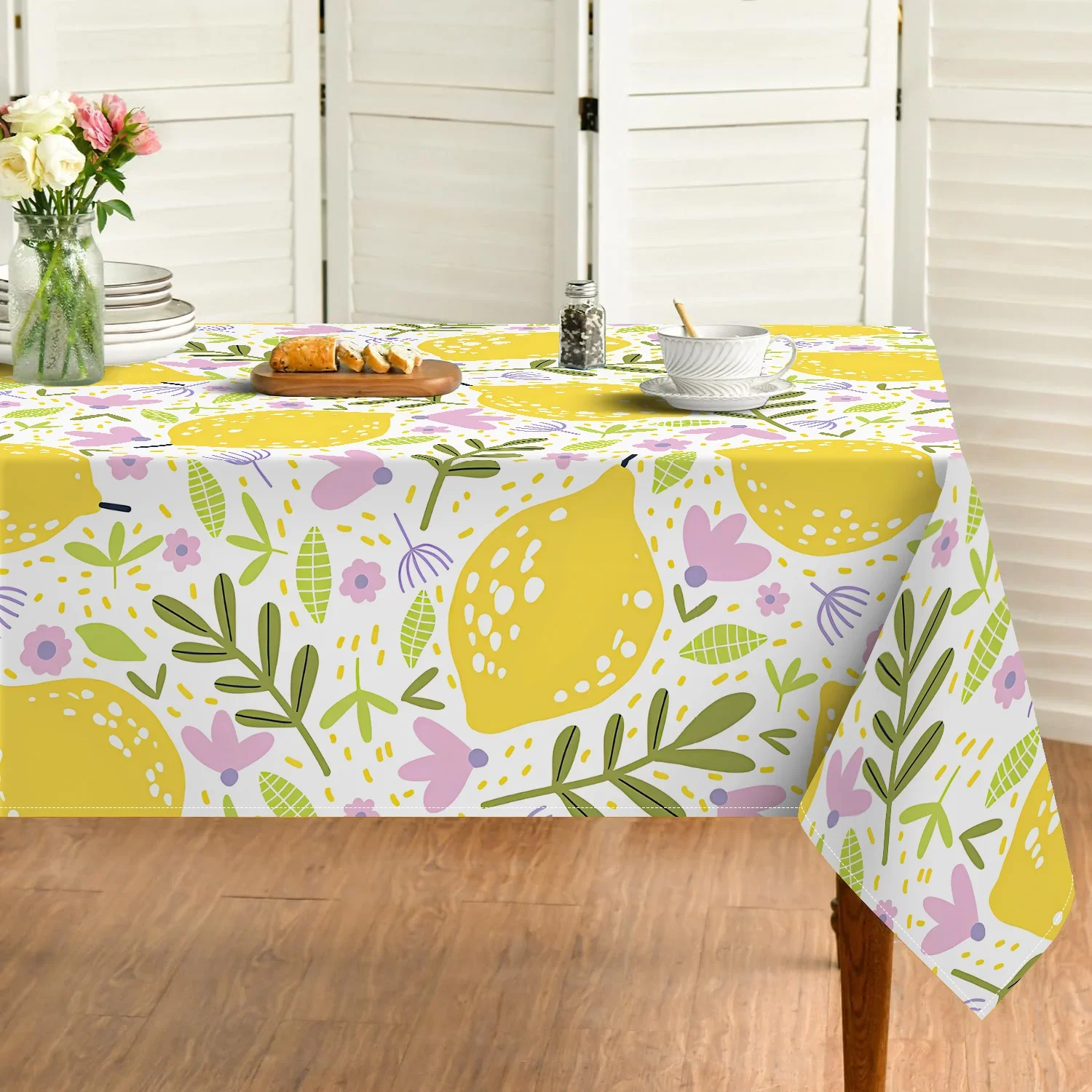 One polyester tablecloth, featuring a design of spring lemon and leaves. Easy to clean and perfect for use in a restaurant.xzj