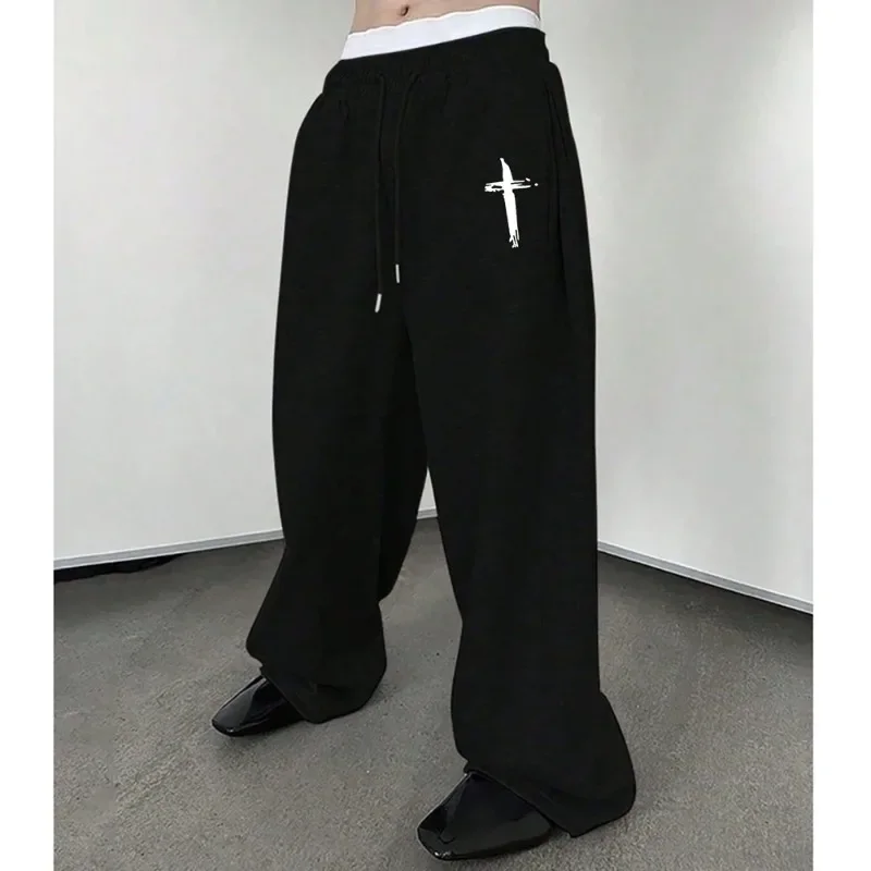 Men's black jogging pants, simple white cross-print design, casual sport pants, elastic waistband drawstring pants