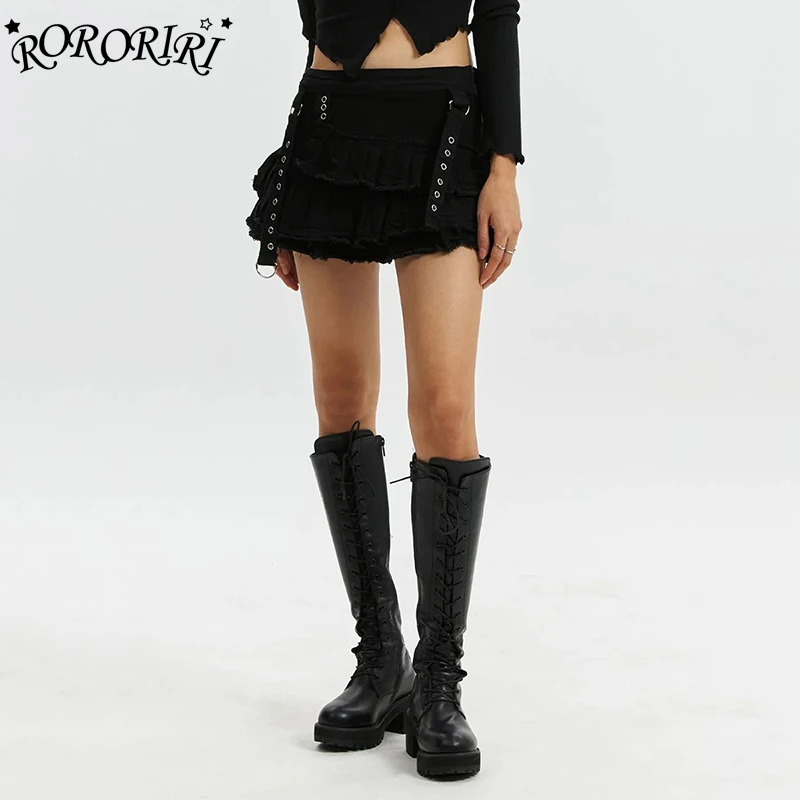 

RORORIRI Punk Eyelets Denim Mini Skirt for Women Solid Black Stretch Raw Hem Low Rise Pleated Cake Skirt Retro Grunge Streetwear