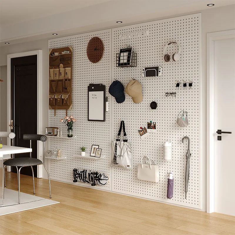 The whole wall of the living room is retracted into door hanging board, and the wall is decorated with metal punched board