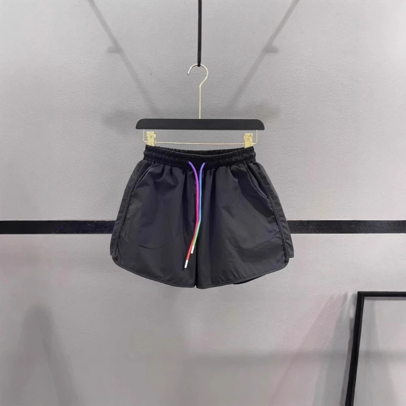 2025 Nuevos pantalones cortos de pierna ancha con cordón de color caramelo transpirable de algodón de verano para mujer